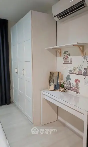 Charming bedroom with stylish wardrobe and air conditioning, perfect for modern living.