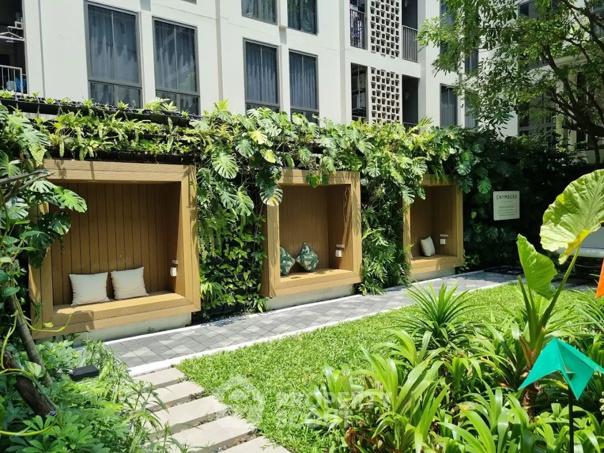 Luxurious garden area with cozy seating in modern residential complex