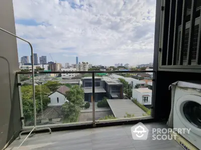 Stunning city view from a modern balcony with washing machine