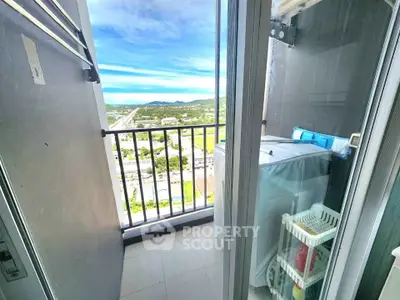 High-rise balcony with scenic view and washing machine setup