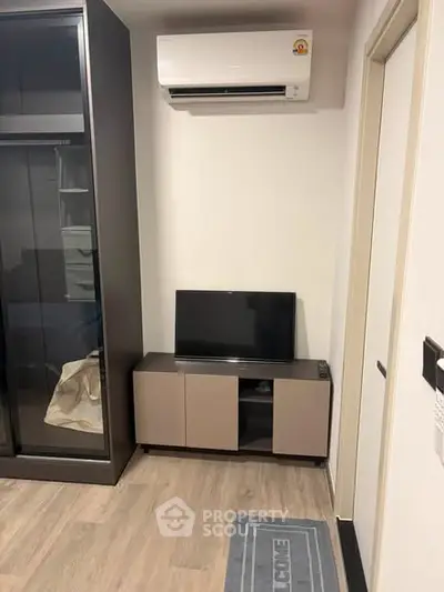 Modern apartment interior with air conditioning and sleek furniture design.