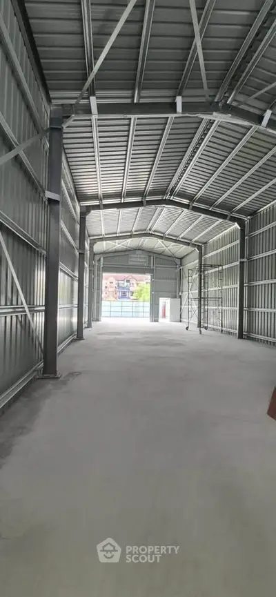 Spacious industrial warehouse with high ceilings and ample natural light