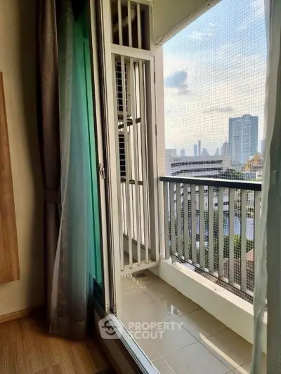 Charming balcony with city view, perfect for relaxing and enjoying the skyline.