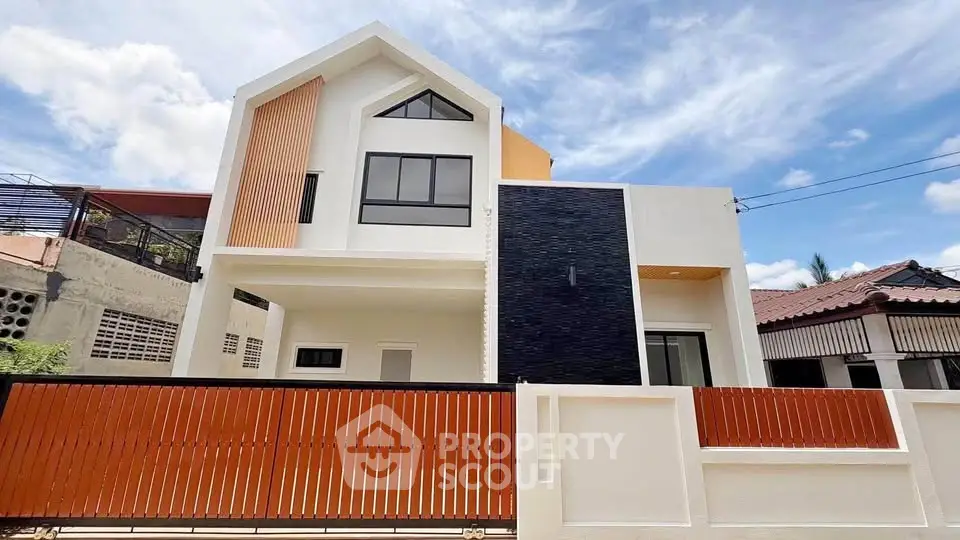 Modern two-story house with unique facade and stylish design