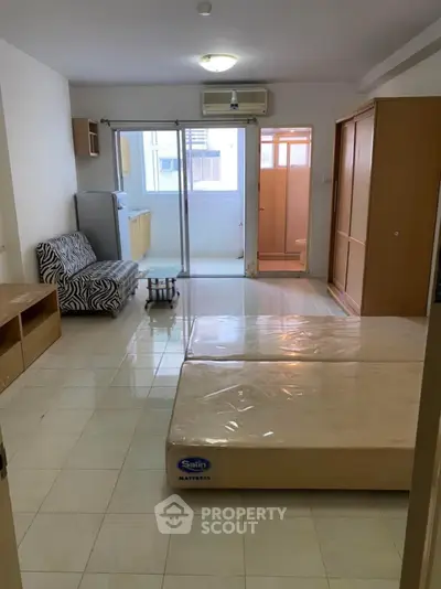 Spacious studio apartment with modern furnishings and natural light
