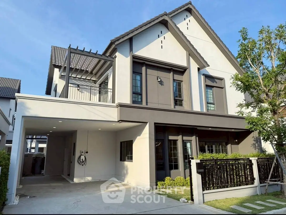 Modern two-story house with stylish facade and spacious driveway