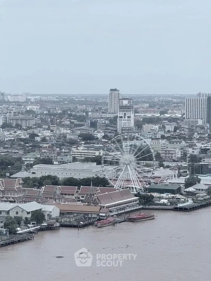 Stunning cityscape view with a ferris wheel and river, perfect for urban living enthusiasts.