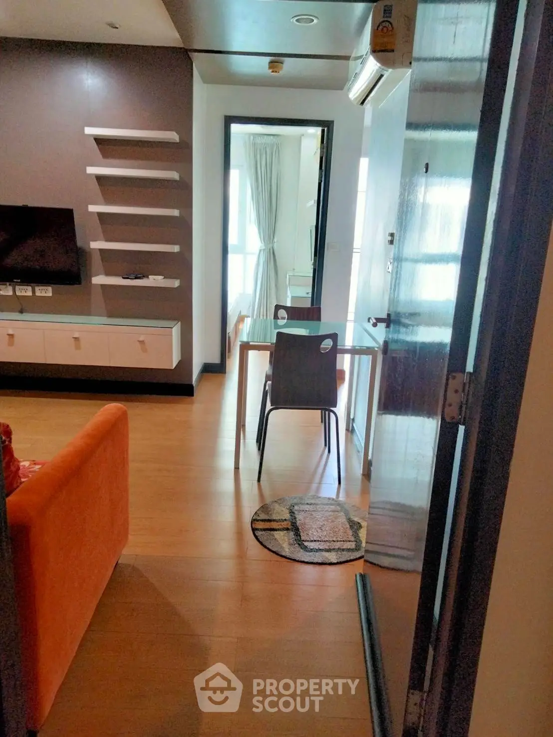 Modern apartment interior with open layout, featuring stylish furniture and natural light.