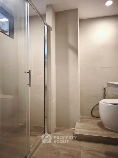 Modern bathroom with glass shower and sleek design