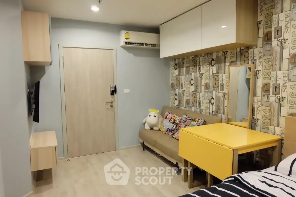 Modern studio apartment with stylish decor and compact living space
