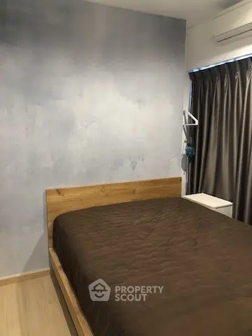 Cozy bedroom with wooden bed frame and modern decor