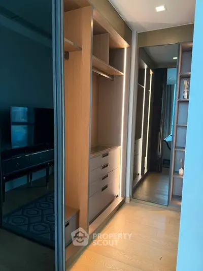 Modern apartment with sleek walk-in closet and stylish living room