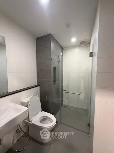 Modern bathroom with sleek design and glass shower enclosure