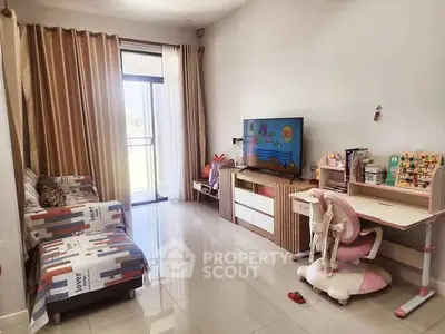 Charming living room with modern decor and natural light, ideal for family gatherings.