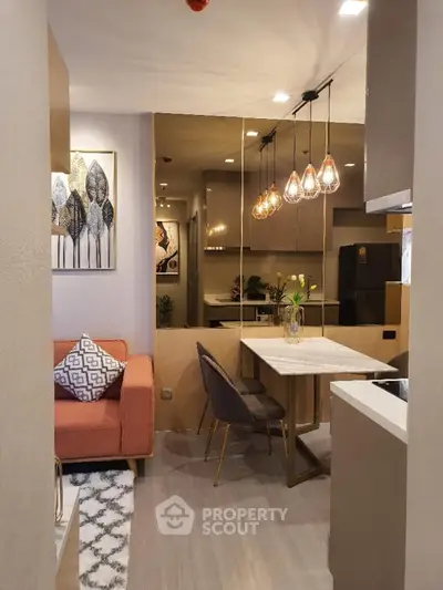 Modern open layout living room and kitchen with stylish decor and lighting