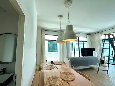 Modern living room with stylish lighting and cozy decor