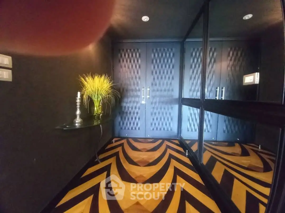 Stylish entrance with modern decor and geometric flooring
