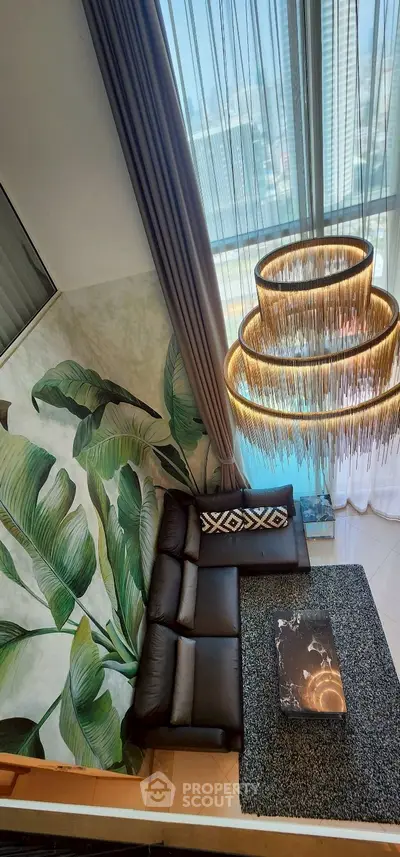 Luxurious living room with elegant chandelier and modern decor