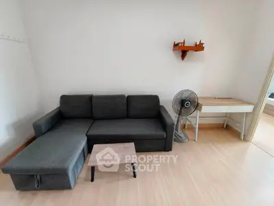 Modern living room with sleek gray sofa and minimalist decor