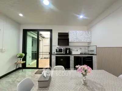 Modern kitchen with sleek design, featuring marble countertops and open layout, perfect for contemporary living.