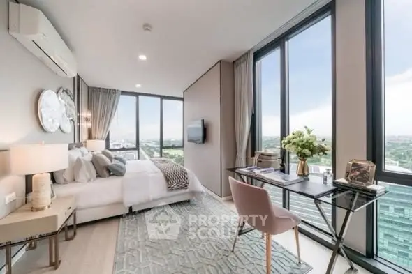 Luxurious bedroom with stunning city view, modern decor, and elegant workspace.