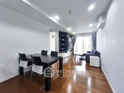Spacious modern living room with wooden flooring and stylish furniture