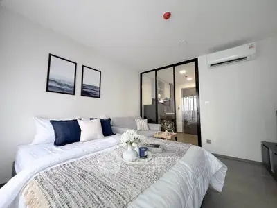 Modern bedroom with cozy decor and open layout in a stylish apartment.