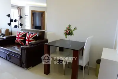 Modern living room with leather sofa and stylish dining area