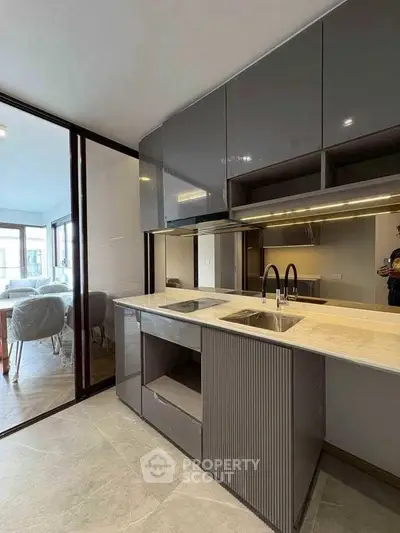 Modern kitchen with sleek cabinets and open layout design
