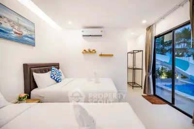 Modern bedroom with pool view and elegant decor