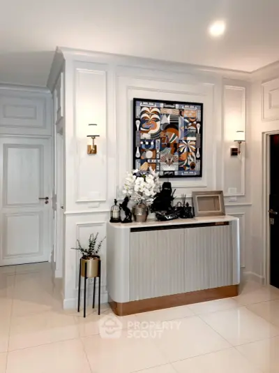 Elegant interior with modern decor and stylish wall art in a luxurious living space.
