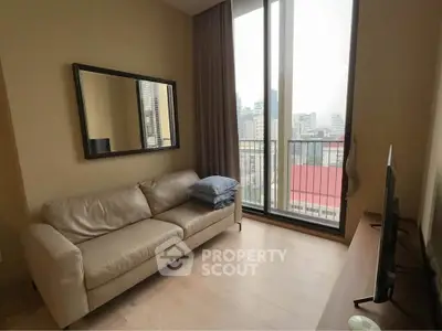 Modern living room with city view, featuring a sleek sofa and large window for natural light.