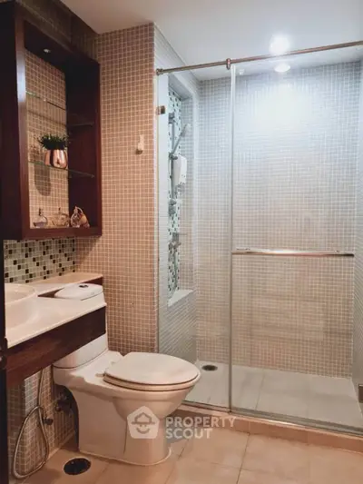 Modern bathroom with glass shower and stylish tile design