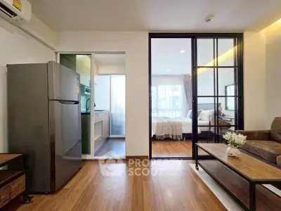 Modern apartment interior with open layout, featuring a cozy living room, sleek kitchen, and inviting bedroom.