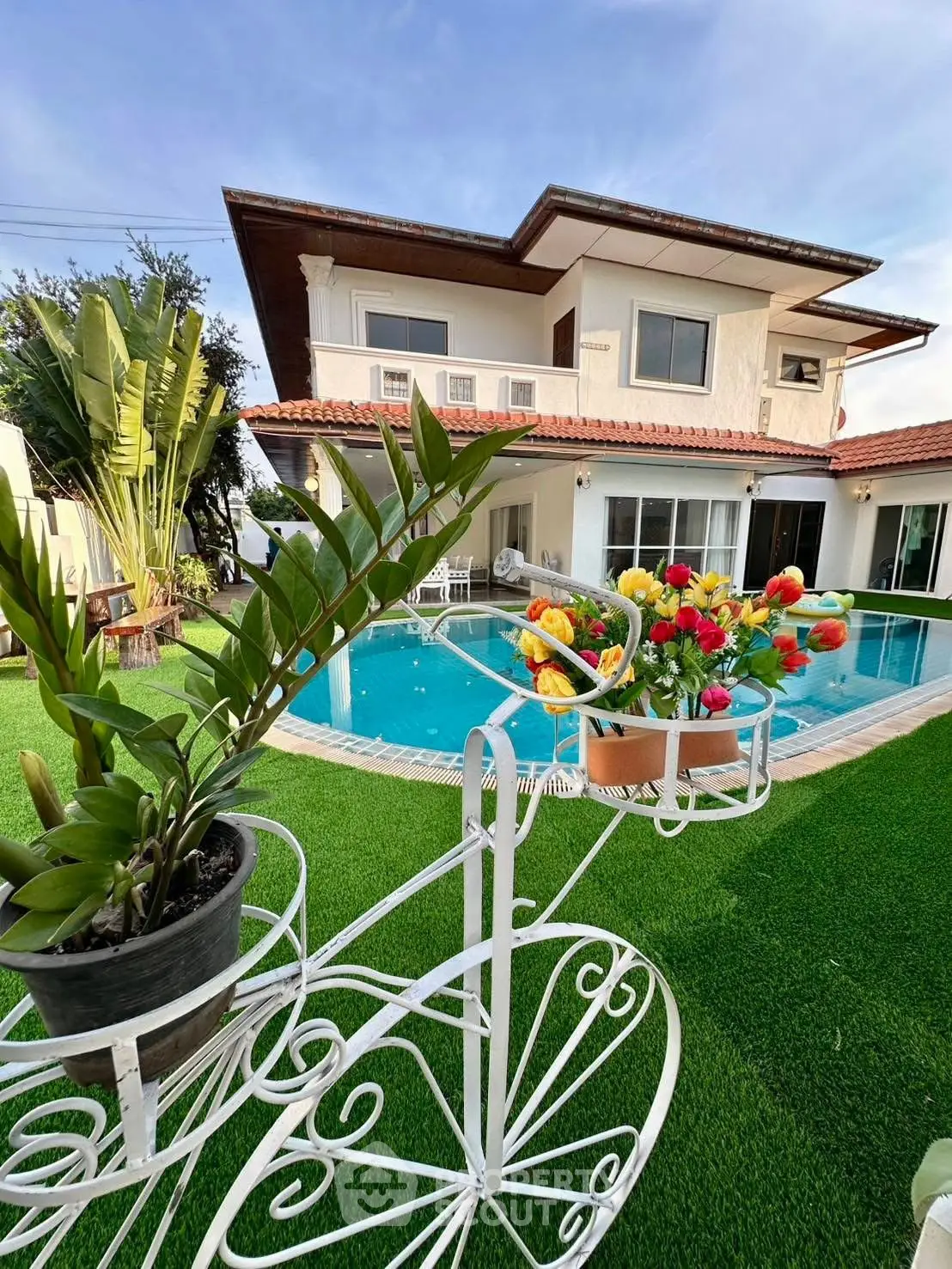 Luxurious villa with private pool and lush garden, perfect for serene living.
