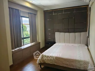 Cozy bedroom with modern design and large window view