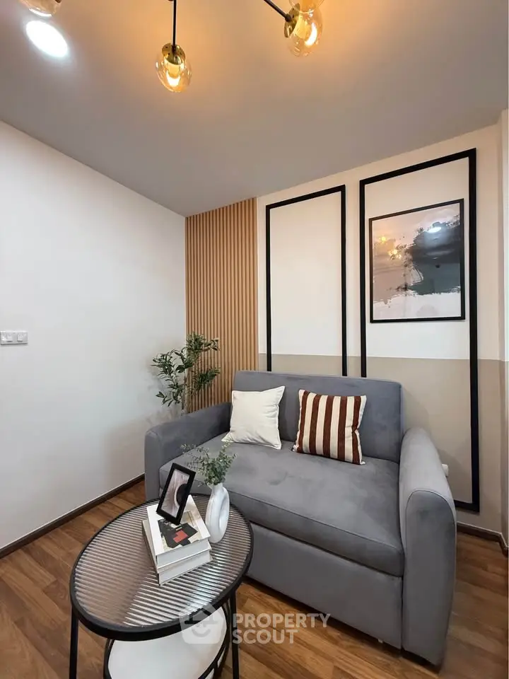 Modern living room with stylish decor and cozy gray sofa