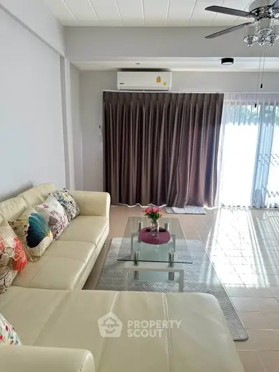 Spacious living room with modern decor and natural light