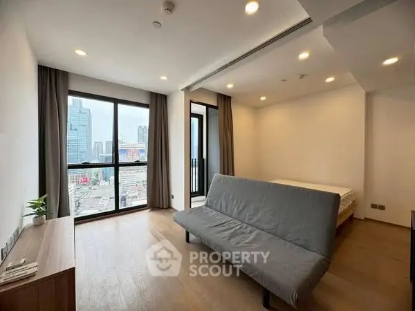 Modern studio apartment with city view and sleek furnishings