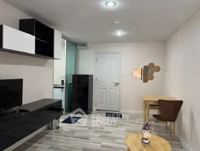 Modern living room with sleek furniture and stylish decor in a contemporary apartment.