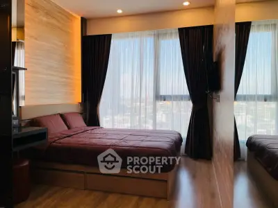 Luxurious bedroom with floor-to-ceiling windows and elegant decor