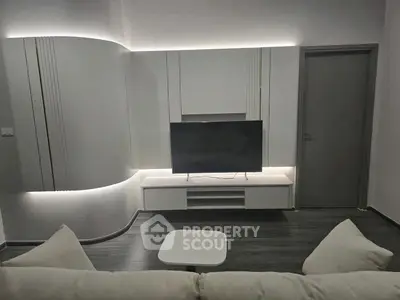 Modern living room with sleek TV unit and ambient lighting