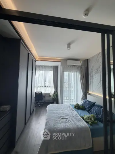 Modern bedroom with stylish decor and natural light