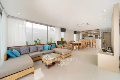 Spacious modern living room with open kitchen and elegant decor
