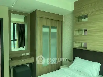 Modern bedroom with sleek wooden wardrobe and stylish decor