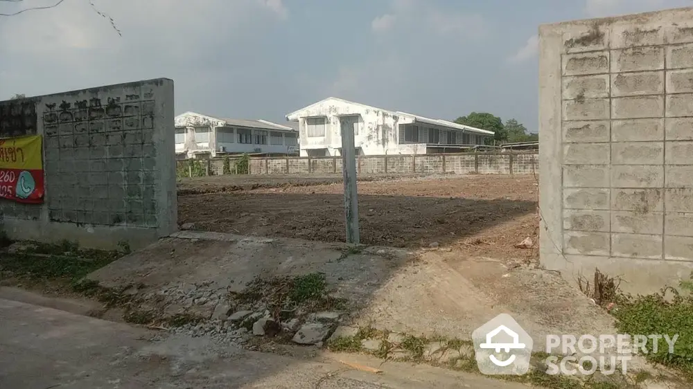 Expansive vacant land ready for development, surrounded by newly constructed homes in a promising neighborhood, ideal for residential projects.