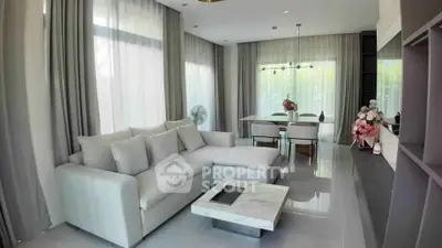 Elegant modern living room with large windows and stylish decor
