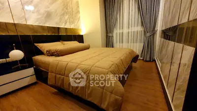 Luxurious bedroom with elegant decor and large window drapes