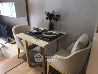 Elegant dining area with modern furniture and tasteful wall decor, perfect for intimate meals in a contemporary home setting.