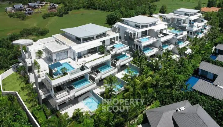Luxurious modern villas with private pools and lush greenery